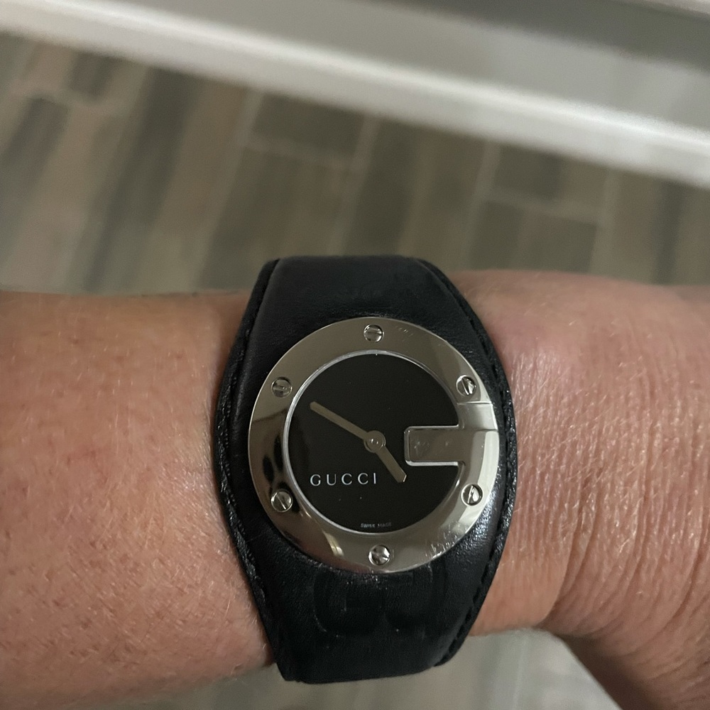 Authentic Gucci G silver logo watch with genuine black leather double GG band.